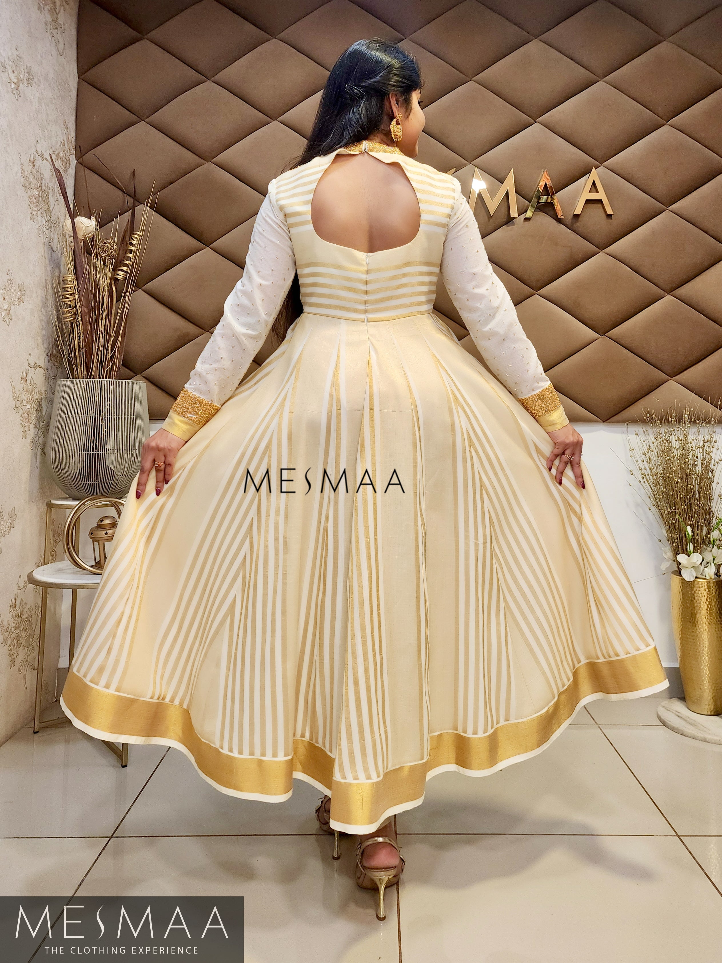 Golden white kerala type anarkali.