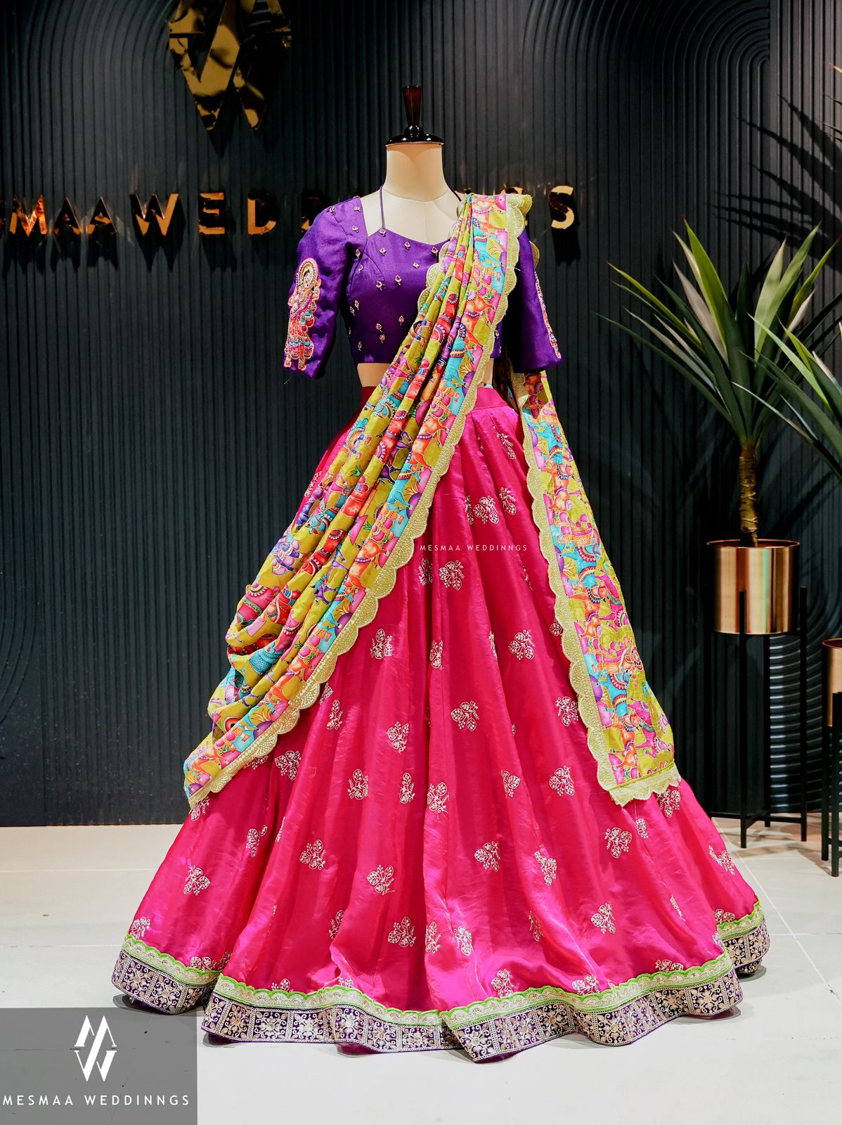 Pink green violet lehenga.