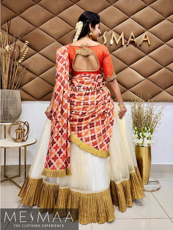 Half white orange half saree