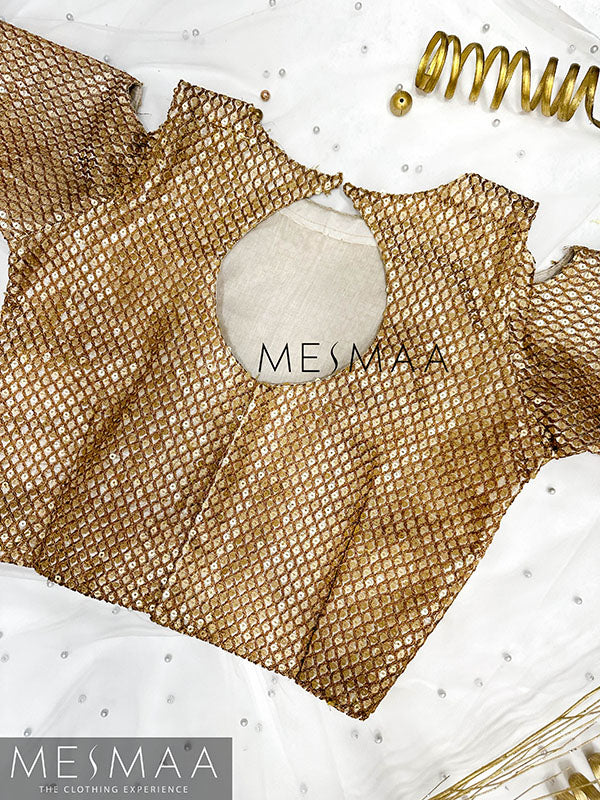 Gold embroidered blouse.