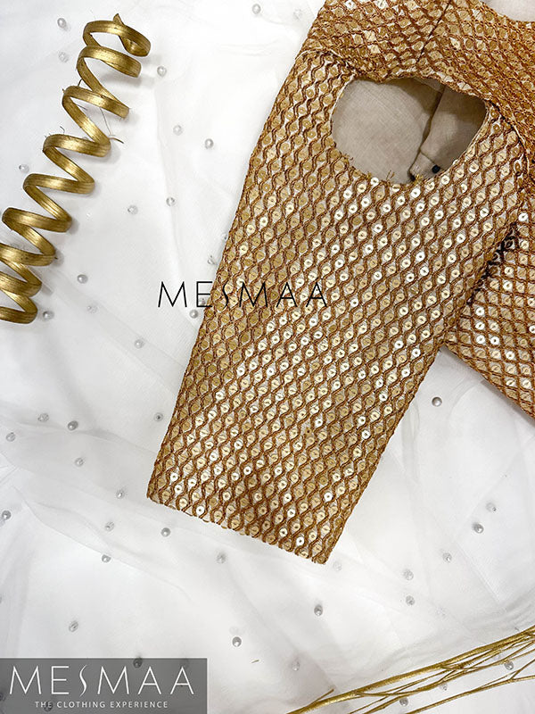 Gold embroidered blouse.
