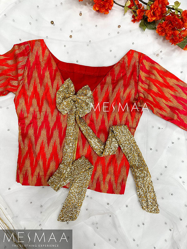 Pinkish orange banaras silk top.