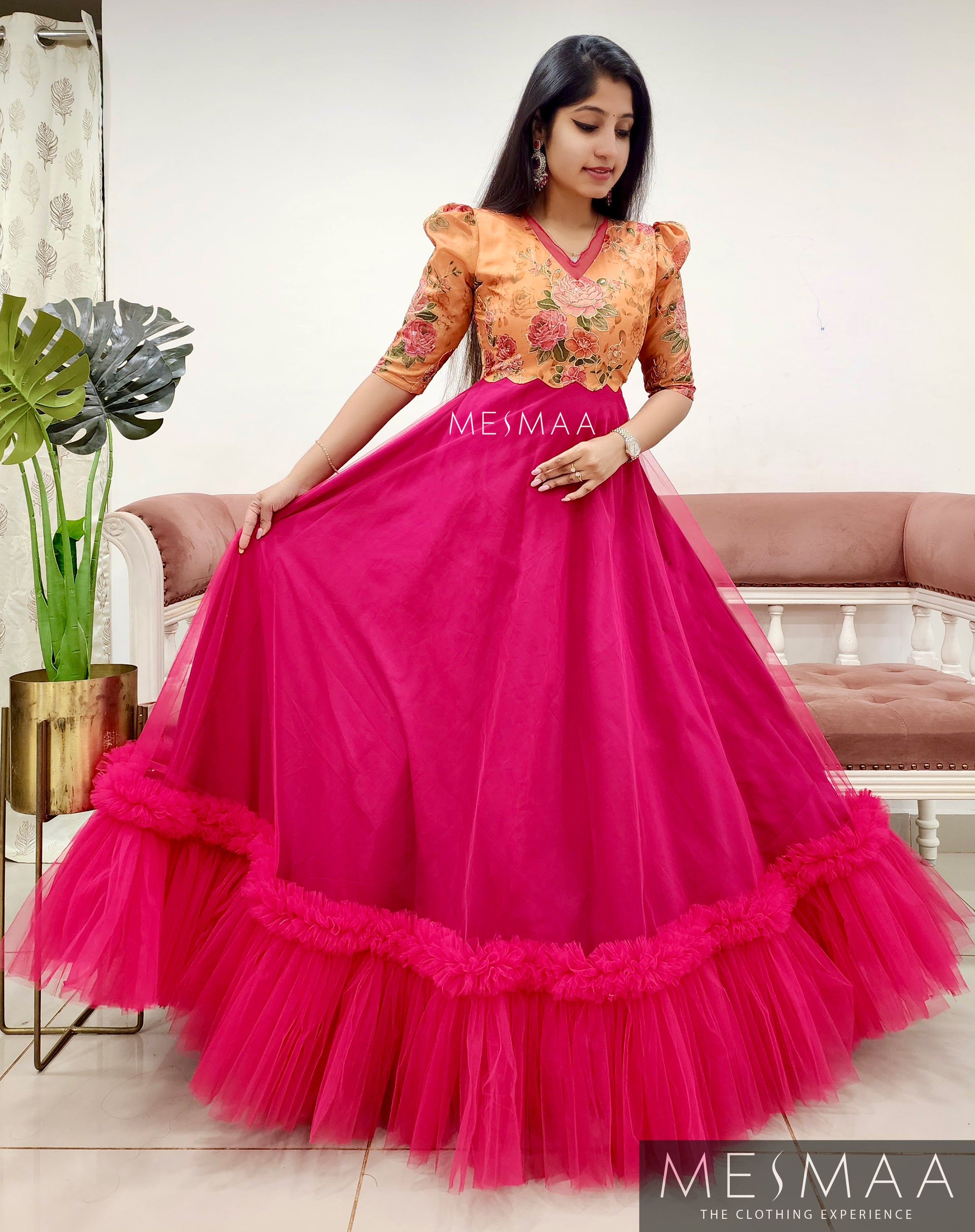 Tangerine ruby pink flared gown.
