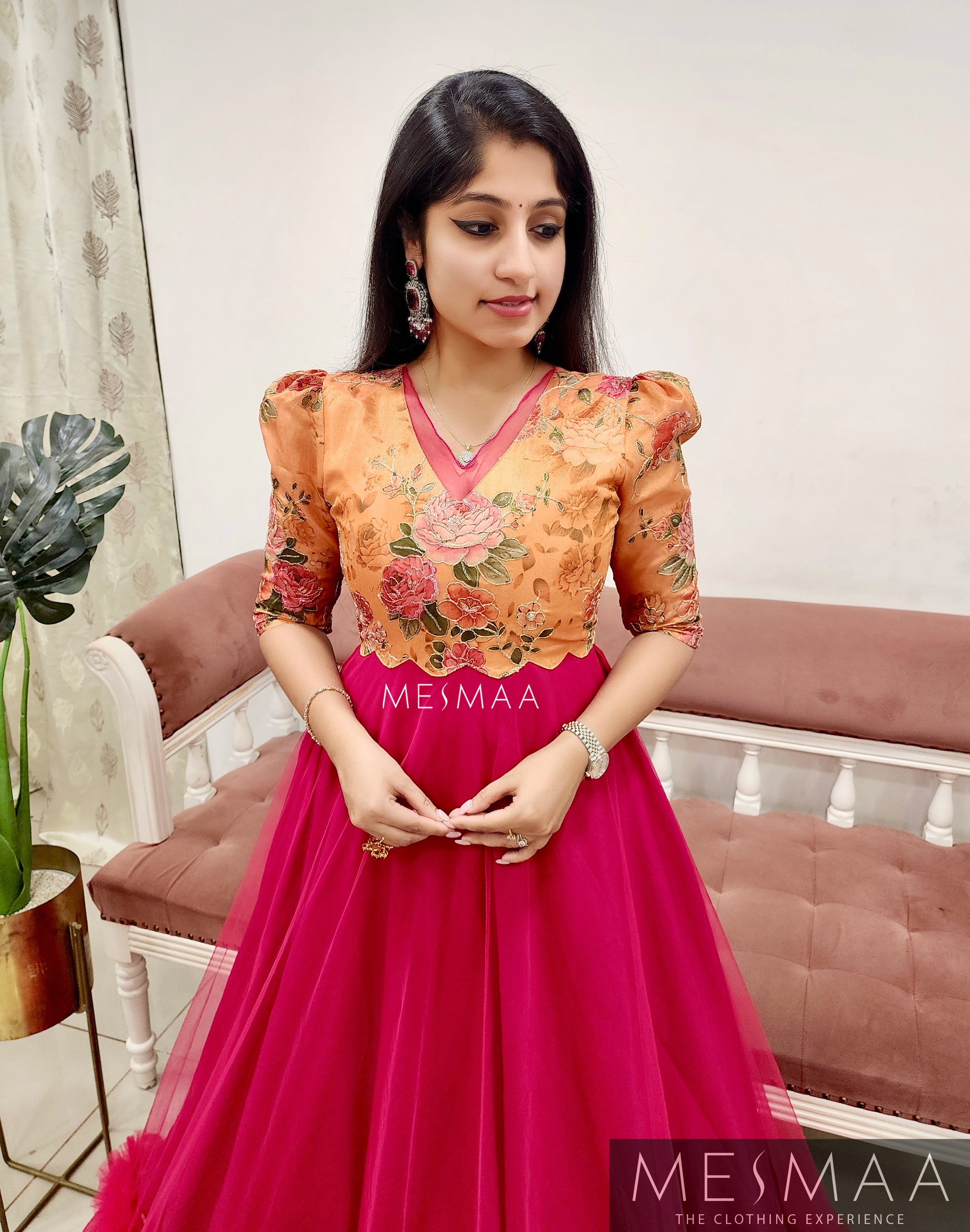 Tangerine ruby pink flared gown.