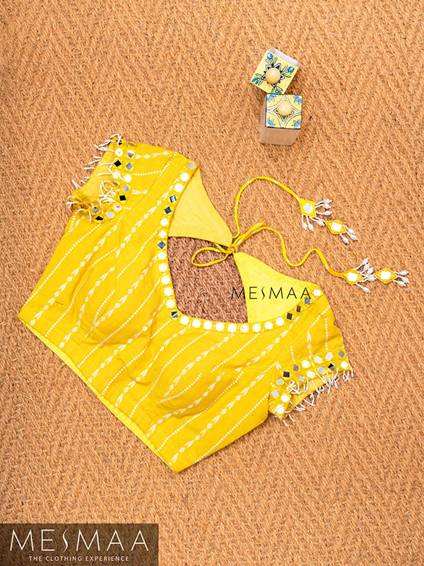Bright yellow mirror worked blouse.