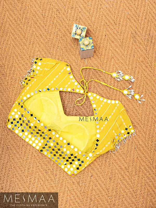 Bright yellow mirror worked blouse.