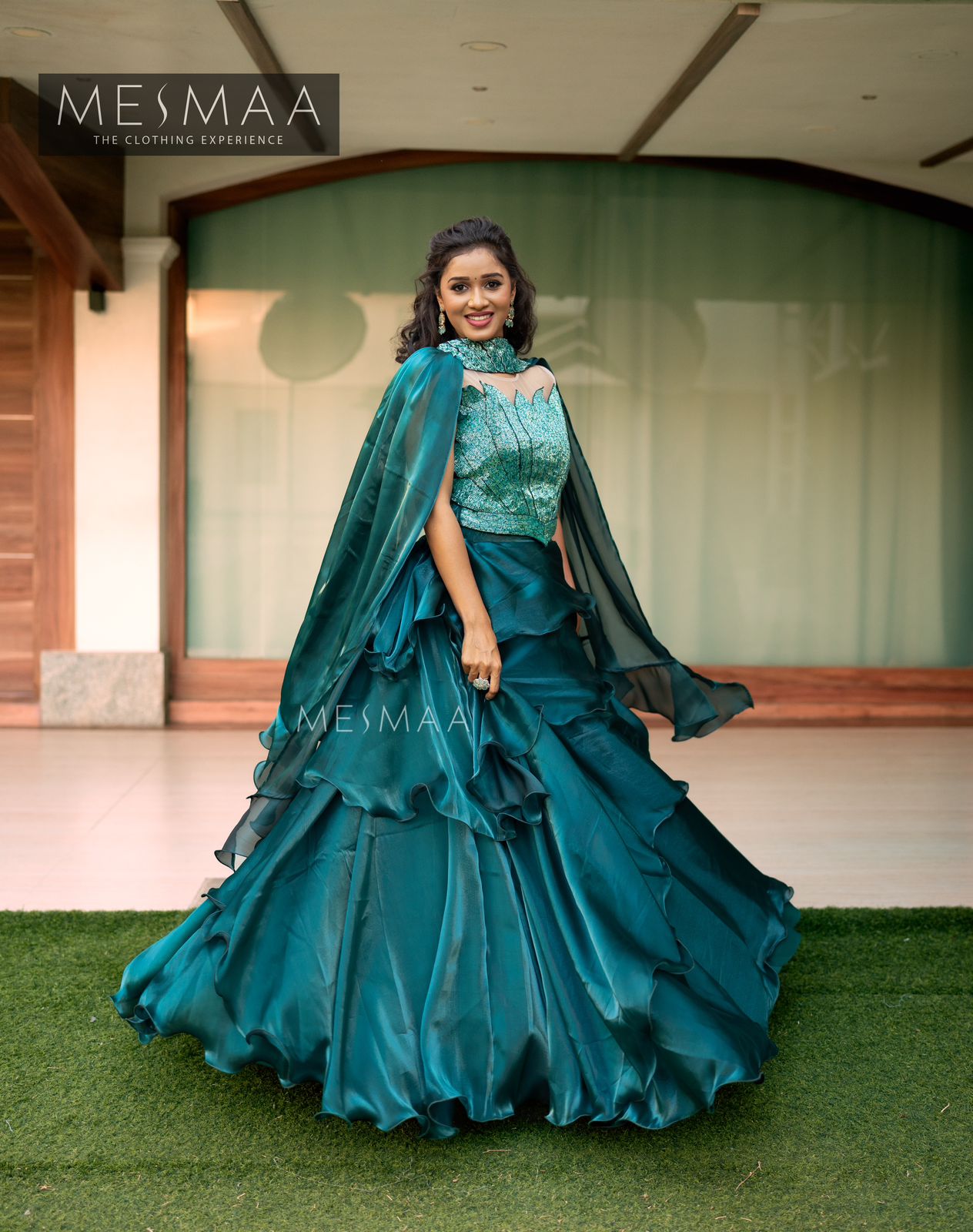 Teal lotus layered lehenga.