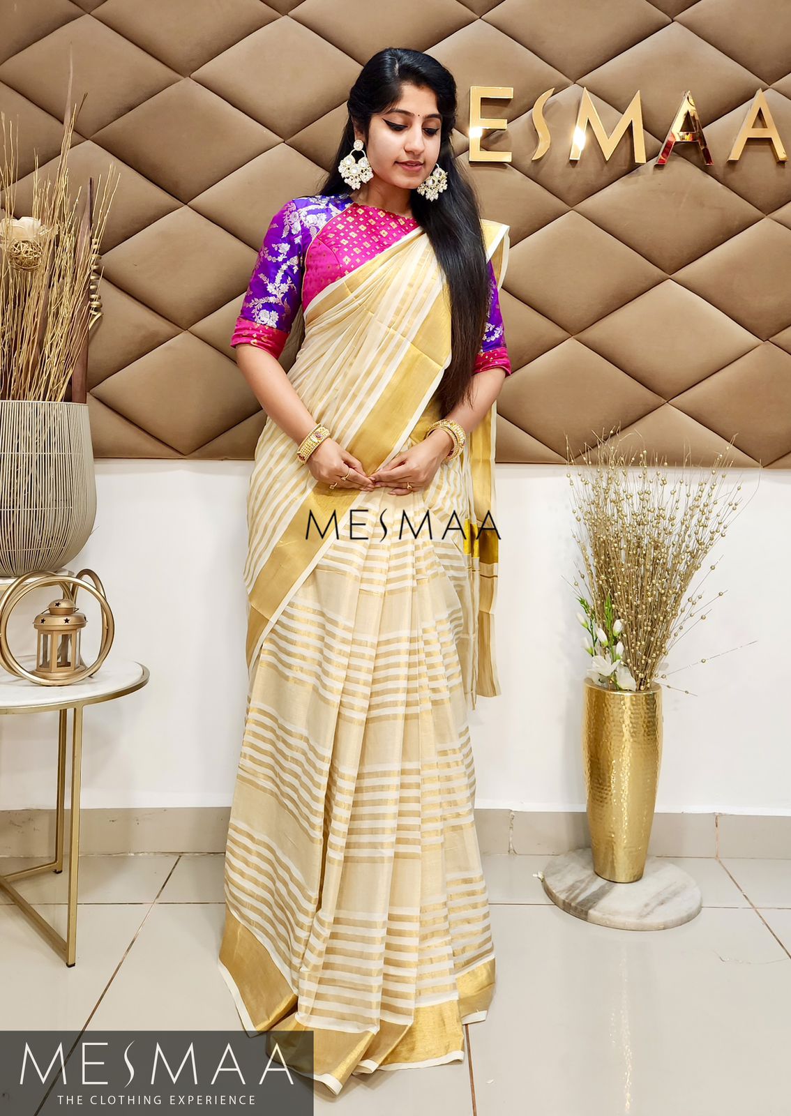 Striped cotton kasavu saree.