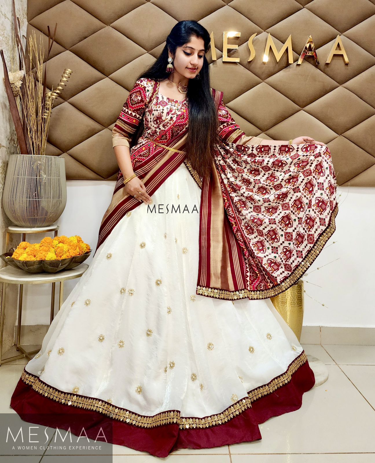 White maroon Patola lehenga.