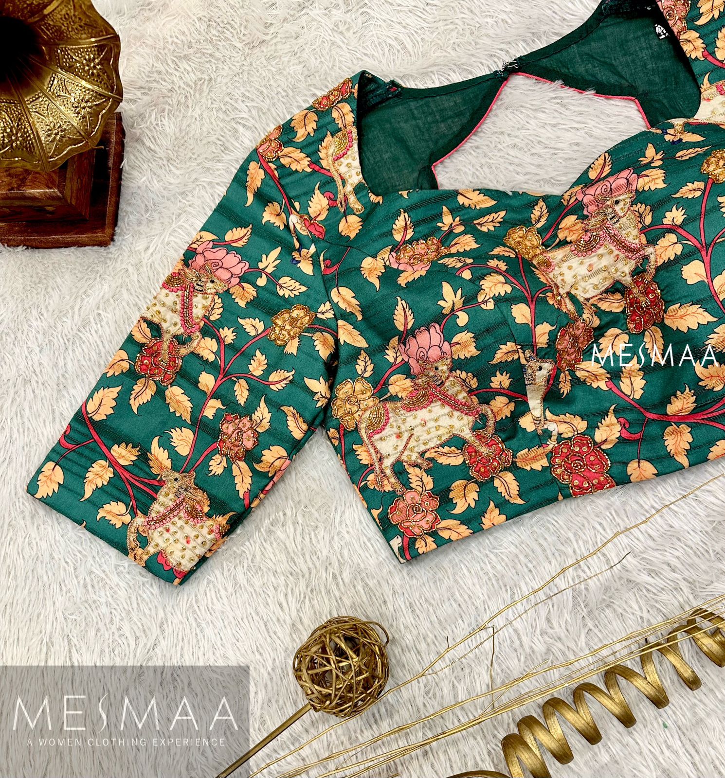 Teal green Pichwai blouse.
