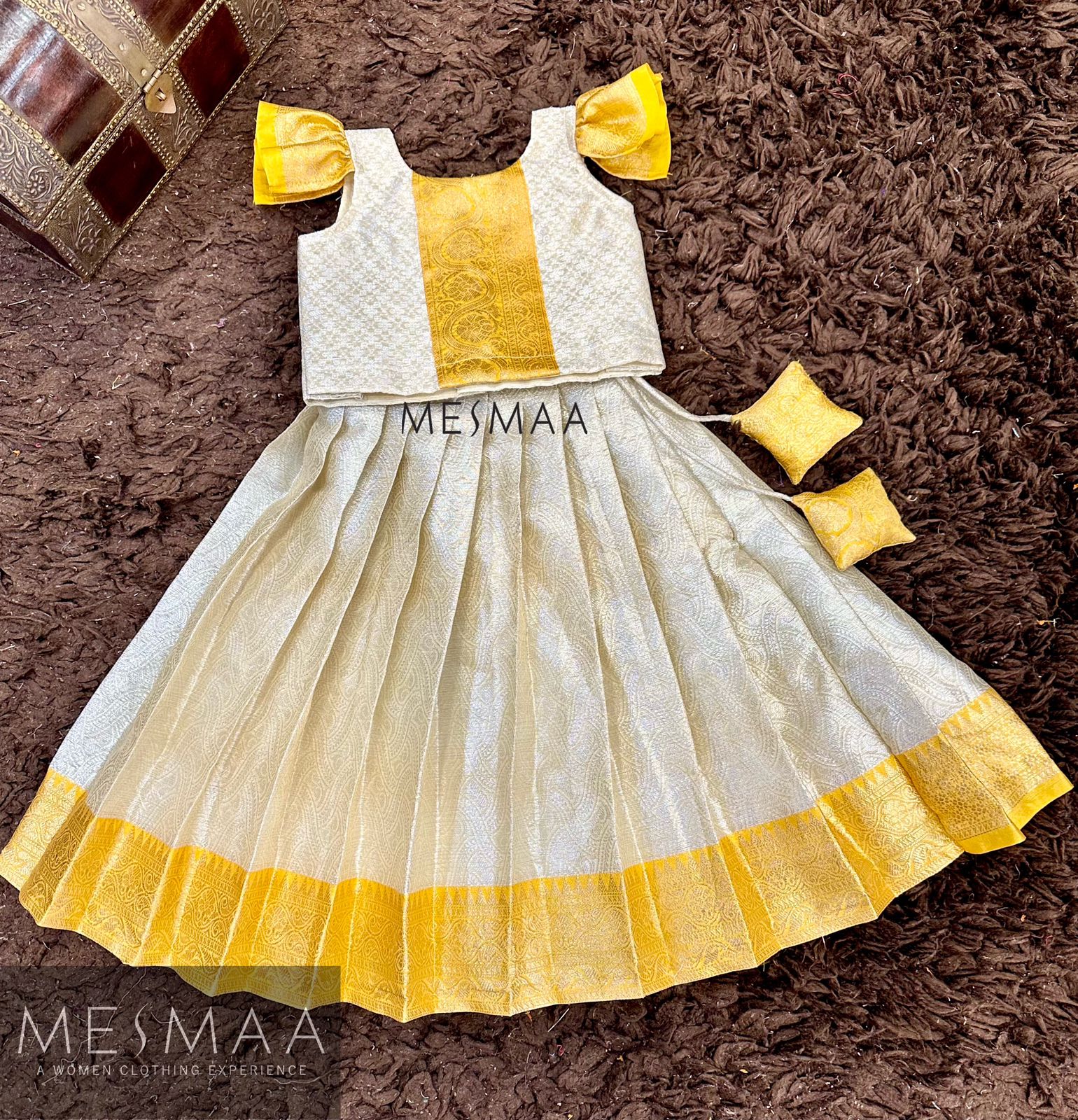 Yellow water gold pattu pavadai.