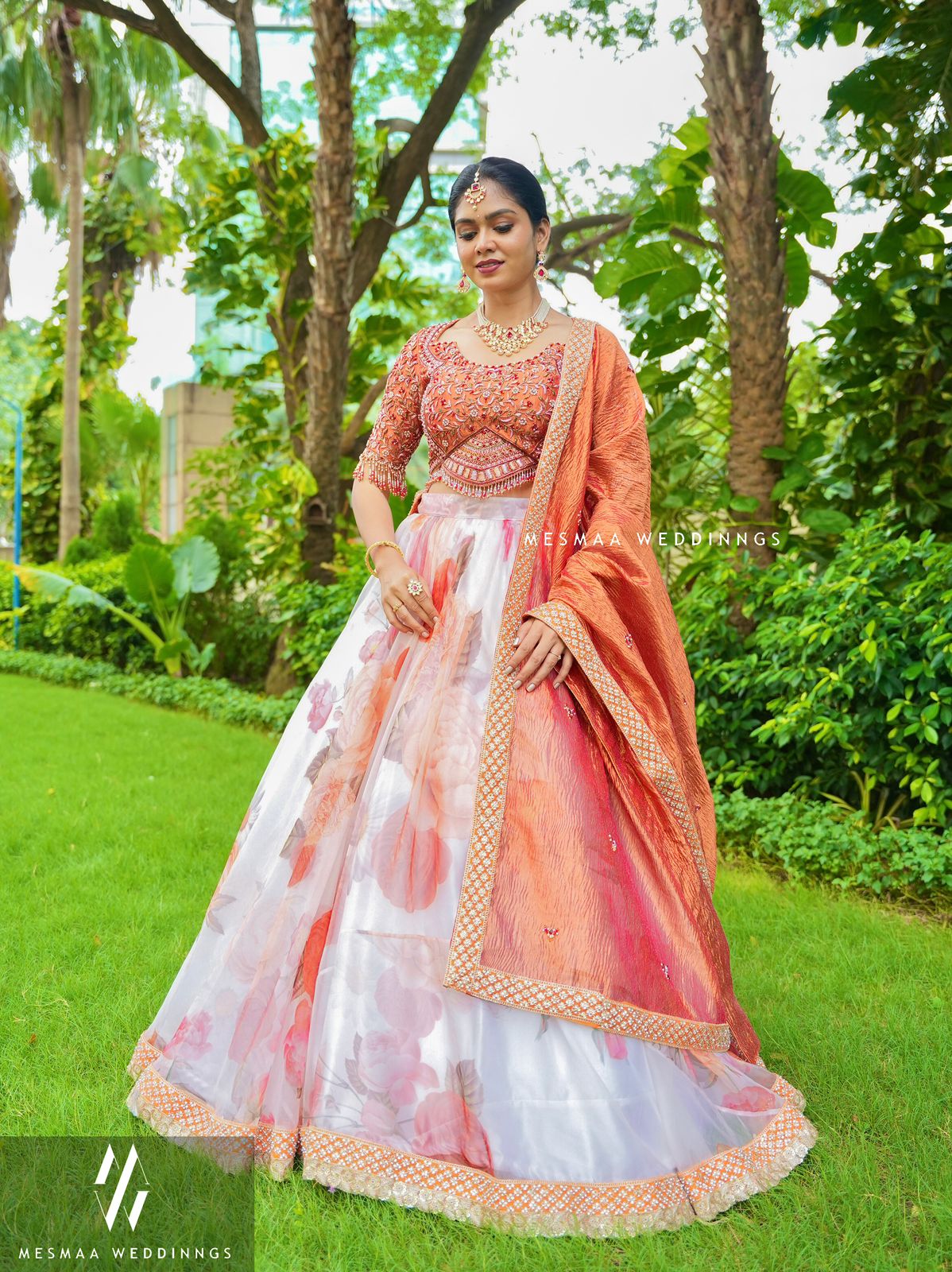 WHITE MATTALIC RUST FLORAL LEHENGA.