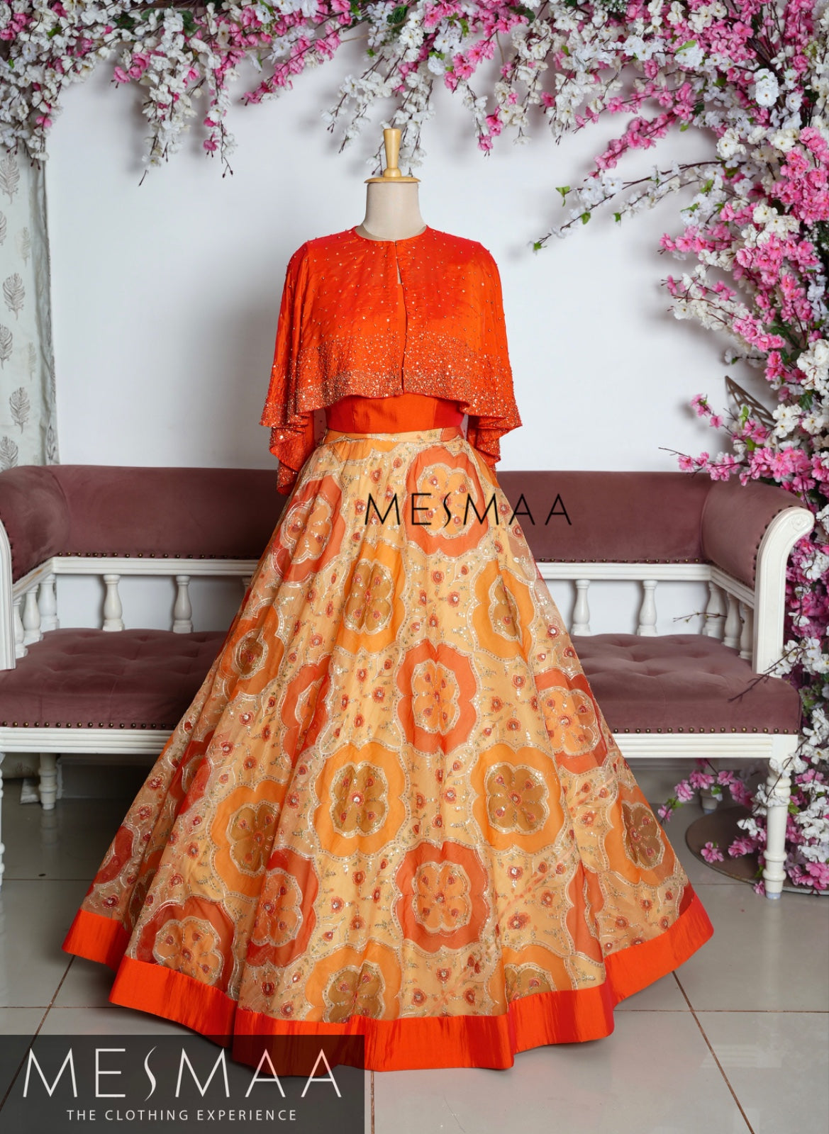 Orange beige cape lehenga.