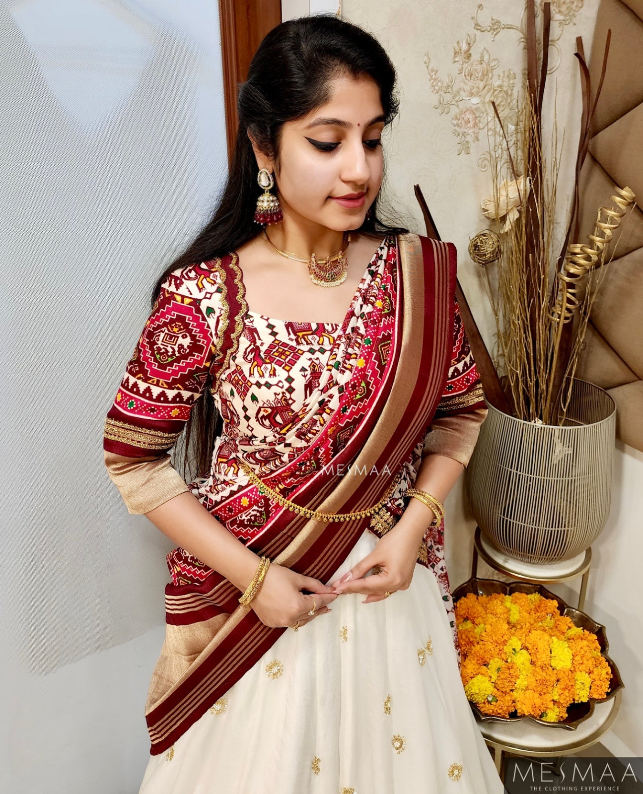 White maroon Patola lehenga.