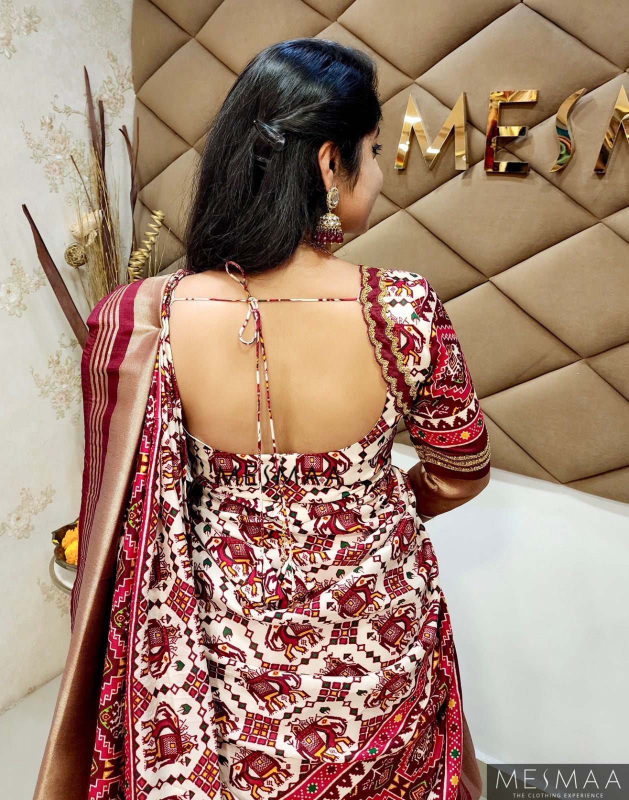 White maroon Patola lehenga.
