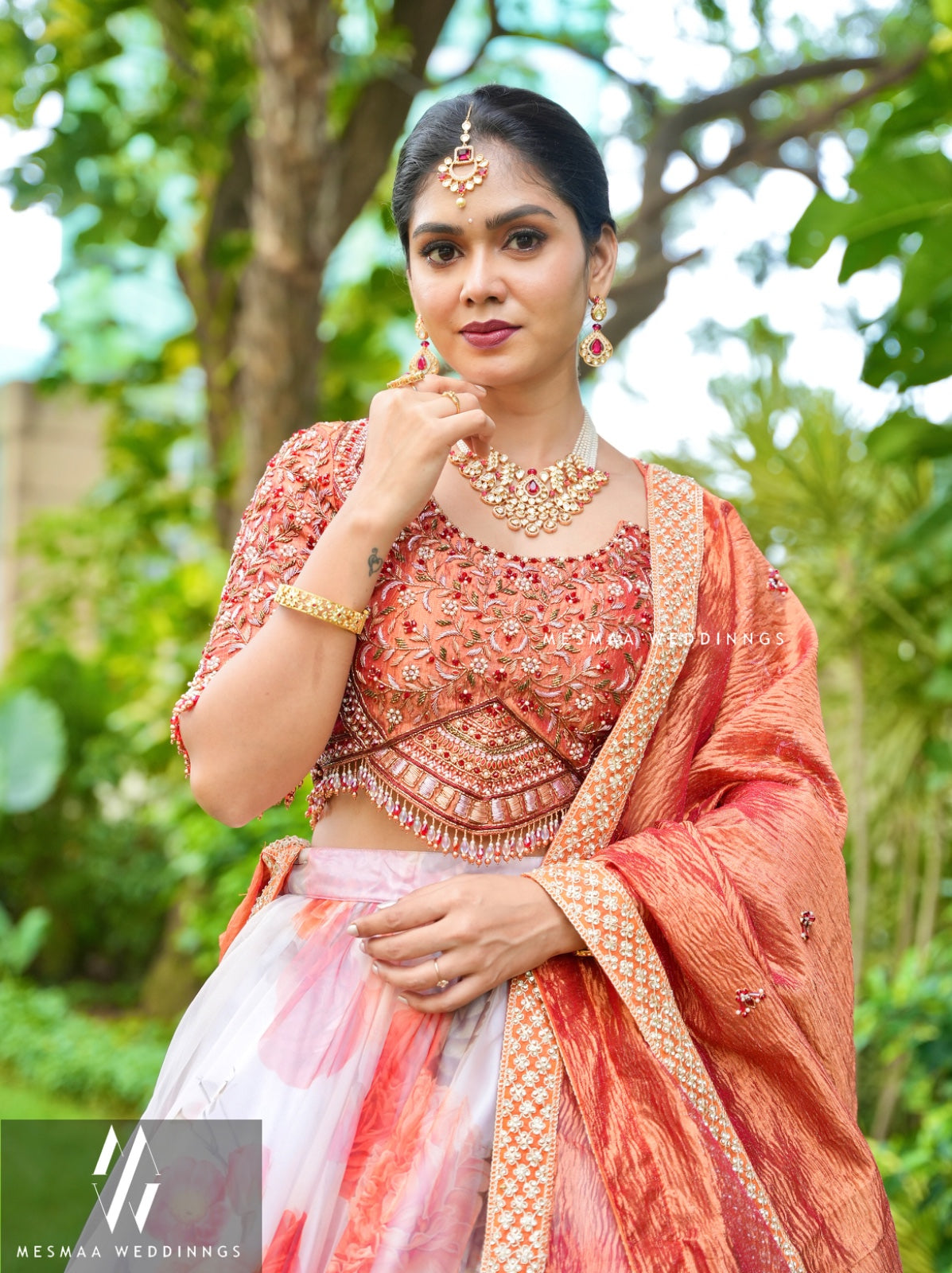 WHITE MATTALIC RUST FLORAL LEHENGA.